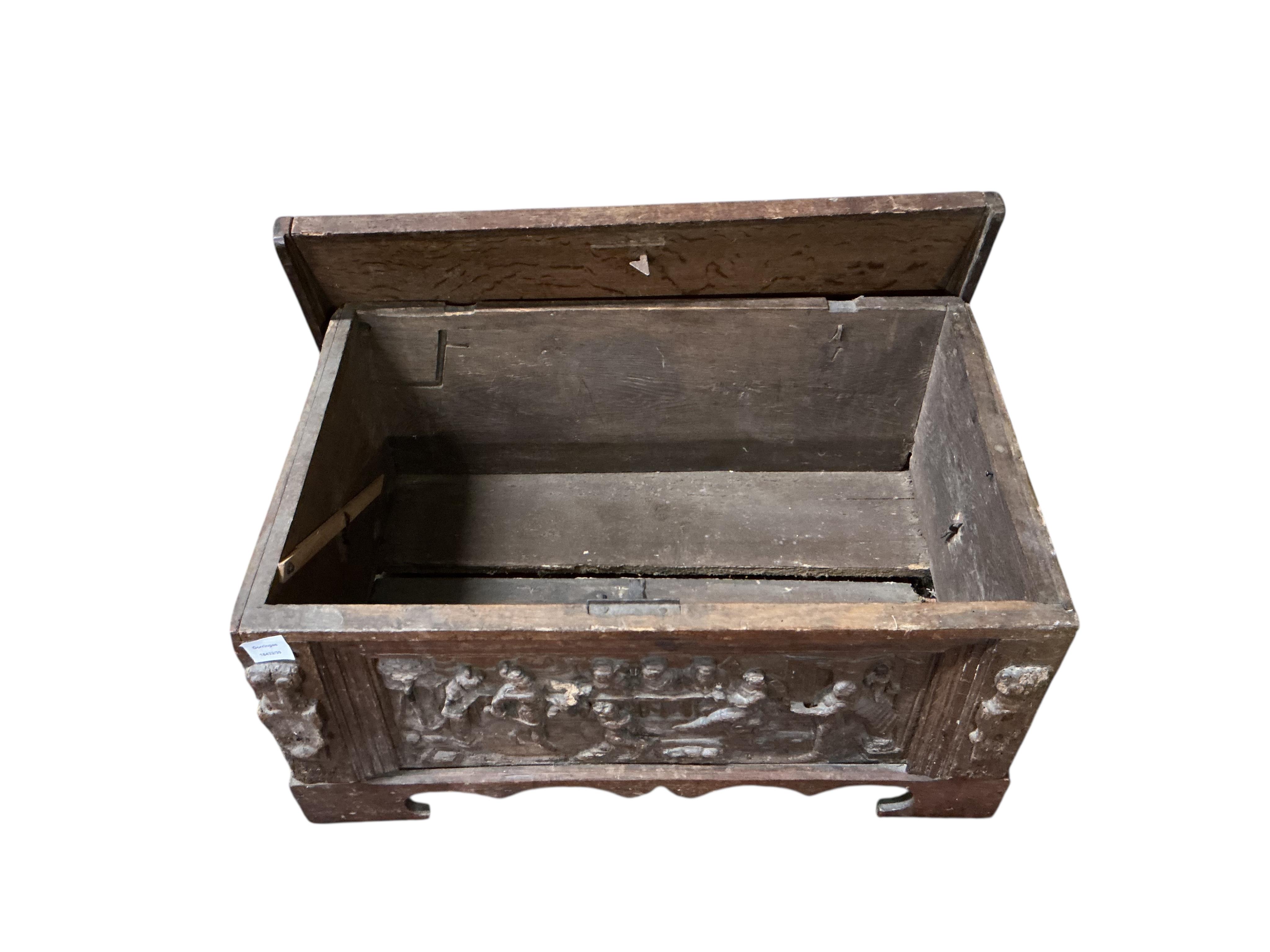 A small 17th century style carved oak domed top trunk, width 79cm, depth 50cm, height 41cm